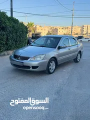  15 ميتسوبيشي لانسر فحص كامل 1600اصلي ولا ملاحظه موديل 2009 اوتوماتيك بوضع الشركه وارد الكويت مالك واحد