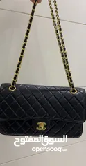  2 Chanel black classic flap bag