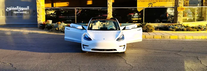  2 تيسلا 2021 model 3 فحص كامل 4 جـيـد فرش ابيض جنط 19بحالة الوكالة لون مميز للبيع بسعر لقطة ومحروووق