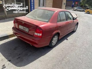  12 مازدا 323 موديل ال2003 باعتبار فحص كامل