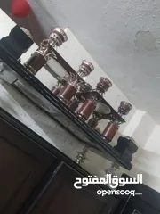  2 طاولات قزاز نفس الصوره وحده كبيره وثنتين صغار