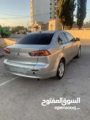  2 ميتسوبيشي لانسر 2012  اصل اسكرا ضفه  لون سكني  تحكم  كشافات زينو  جنط مغنسيوم تعتيم فرش جلد اصلي  مس