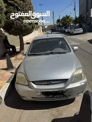  1 كيا ريو بحالة ممتازة  جير عادي 2004