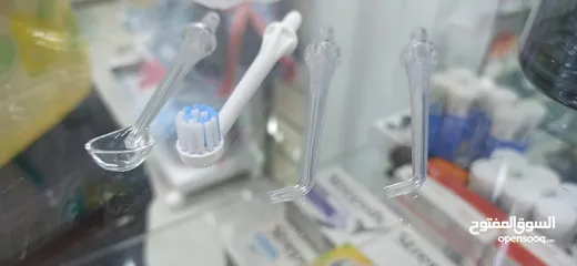  2 جهاز تنظيف الاسنان بالماء المضغوط