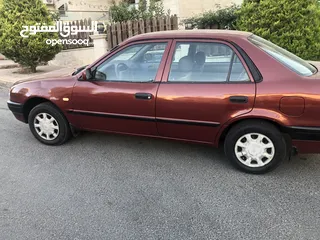  1 تويوتا كوروللا اوتوماتيك اصلي  موديل 2000