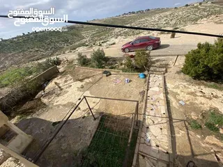  5 أرض مساحة 6دونمات مع بيت 230 متر