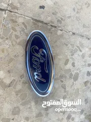  2 شعار فورد خلفي + حمالات صندوق خلفي + عاكسة مكسور طرفها (جميعهم بـ 10 دنانير)