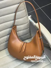  12 شنتة ستاتي اصلي مع العلبة  جلد طبيعي جودة عالية جدا  سحاب ويد طويلة  مقاس 21×27
