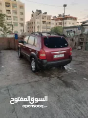  5 جيب هونداي توسان موديل 2007 ماطور 2000 لون خمري كام لا ينقصه شيئ