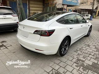  3 تسلا MODEL 3 موديل   2023 رقم بغداد الجديد