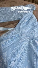  1 ‏فستان سهرة ‏قصير نوعا ما لونه ازرق سماوي ‏