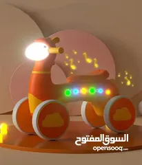  9 دراجة أطفال بأربع عجلات بشكل خروف  مع إضاءة  وموسيقى ممتعة مناسبة للأطفال من عمر سنة ونصف حتى 4 سنوا