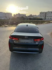  4 كيا K5 هايبرد موديل ال 2018 لون فيراني ميتالك  فحص اربعة جيد ولا ملاحظة فل كامل عدا الفتحة - كاش