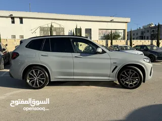  5 BMW x3 30e ترخيص 2022 ترخيص  محرك 2000 هايبرد plug in/يقطع على الشحنه 30 كيلو متر  293 حصان