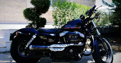  2 Harley Davidson sporster fourty eight 2011 good condition black plus exost
