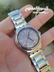  2 #SWATCH  سواتش سويسري اصلي لومينوس شباك للتاريخ  حجم 41 بحالة ممتازه  40 دينار