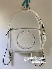  1 GUESS whit ,small bag with silver zippers