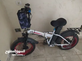  1 موجود 3 بسكليتات كهربا عجل عريض كمبيوتر 1000/600 ..48 فولت ..بطارية21 امبير بحالة ممتازة