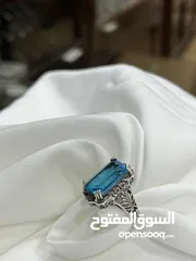  8 *خاتم فضة بحجر أكوامارين – عيار 925، وزن 5.4 جرام