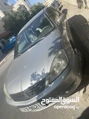  13 ميتسوبيشي لانسر موديل 2010 محرك 1300 سي سي ..الفحص مرفق بالصور