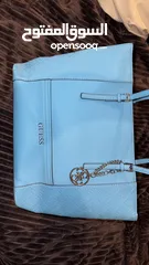  2 GUESS tote bag...beautiful turquoise color...worn once...like new 35jds