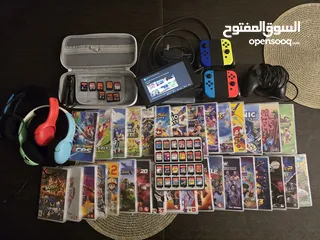  3 Nintendo Switch Bundle with 33 Games (Located Muscat, Madinat Al llam Neighborhood)