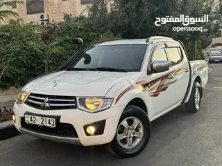  1 ميتسوبيشي L200 بنزين موديل 2015 وارد الشركة ممشى قليل 75 الف كم بحالة الوكالة