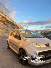  3 بيجو 107 .