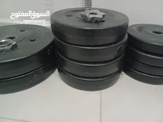  2 50 kg weight training plates, barbell and lock