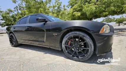  8 Phantom black edition dodge charger for sale with red and black interior, well maintained,
