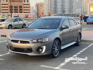  2 2016 Mitsubishi Lancer GT. Excellent conditions beautiful car for sale in Dubai. Al Nadha.