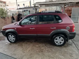  6 جيب هونداي توسان موديل 2007 ماطور 2000 لون خمري كام لا ينقصه شيئ