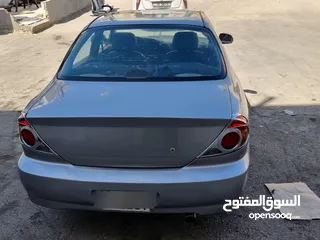  4 كيا سبيكترا 2001 بسعر 2400 جير عادي سياره نظيفه جدا  kia spectra 2001
