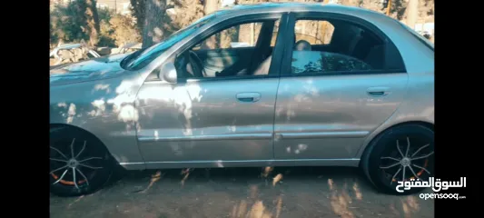  5 دايو لانوس موضيل 2002 بحاله جديدة