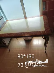  1 طاولة رخام ثقيلة قاعدة حديد واربع كراسي حديد