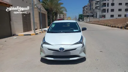  1 تويوتا بريوس لون ابيض لؤلؤي فحص 3 جيد بسعر مغري قابل للبدل