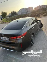  6 كيا K5 هايبرد موديل ال 2018 لون فيراني ميتالك  فحص اربعة جيد ولا ملاحظة فل كامل عدا الفتحة - كاش