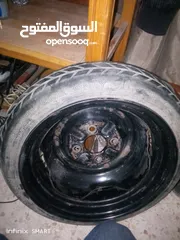  1 جنط مع كوشوك سبير بحال ممتاز قياس 14 ياباني اصلي شركه