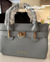  2 New Bebe women’s evie satchel bag