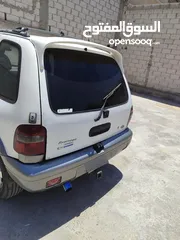  4 كيا سبورتاج موديل 2000 لون ابيض ماتور 2000 توماتيك