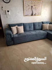  1 كنب زاويه حرف ل بلون تركواز انيق يتحول الى سرير كبير تصميم عملي وعصري بحاله شبه جديد للبيع بالمدينه