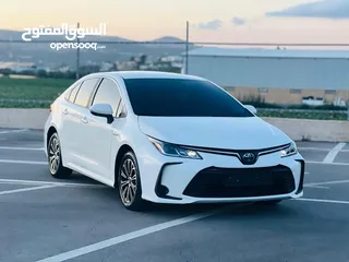  1 تيوتا كورولا هايبرد ترخيص 2022 فل بدون فتحة مميزة  ماتور 1800cc ( بنزين + كهرباء) 170Hp