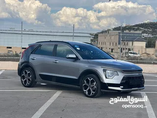  5 كايا نيرو  هايبرد (بنزين+كهرباء ) فل الفل  فتحة سقف  لون مميز اضافات مميزة /2022 جناح اسود