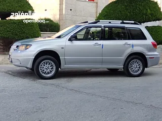 6 ميتسوبيشي آوتلاندر اوتوماتيك 2003 توب نظافة بسعرررر مميززز محرك 2400cc