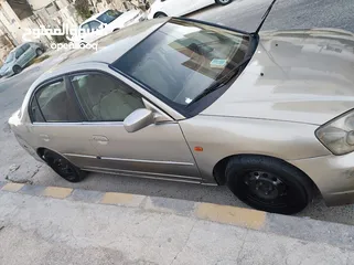  3 هوندا سيفيك لون ذهبي موديل 2003 جير عادي  إقتصادية جدا تقطع بالتنكة 280 كيلو بور ستيرنح سنتر لوك