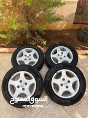  1 جنط بيجو 14 اصلي مع كوشوك جديد