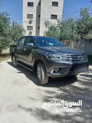  2 بكب تويوتا هايلوكس للبيع اللون فيراني كراسي جلد منجده الماتور غير مفتوح الدهان الاصلي الخط الاصلي