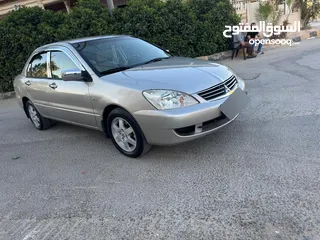  11 ميتسوبيشي لانسر فحص كامل 1600اصلي ولا ملاحظه موديل 2009 اوتوماتيك بوضع الشركه وارد الكويت مالك واحد