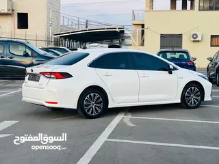  8 تيوتا كورولا هايبرد ترخيص 2022 فل بدون فتحة مميزة  ماتور 1800cc ( بنزين + كهرباء) 170Hp