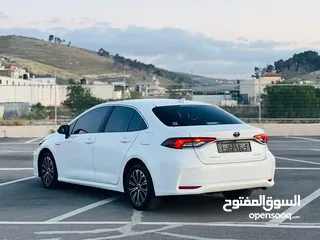  21 تيوتا كورولا هايبرد ترخيص 2022 فل بدون فتحة مميزة  ماتور 1800cc ( بنزين + كهرباء) 170Hp